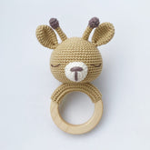 Hand-crocheted deer baby teething rattle with wooden ring